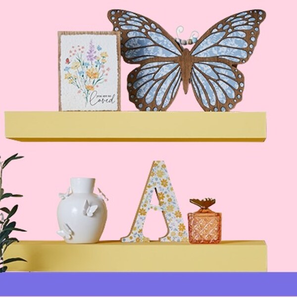 butterfly and floral accents on wood shelves